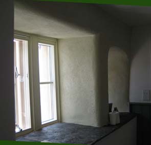 modern and stone mullion windows plastered in rubbed up coarse lime