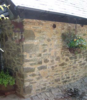stone wall repointed in lime and mud